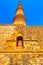 Qutb Minar tower seen through the ruined Quwwat ul-Islam Mosque at Qutub Minar complex - New Delhi, India