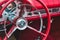 Rabat / Malta - July 24 2019: Close up of red steering wheel inside the cockpit of a Ford Thunderbird sports car