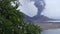Rabaul Papua New Guinea volcano tropical tree and ash cloud