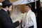 Rabbi reading the Jewish Marriage Contract to Jewish bride and a bridegroom in Jewish wedding ceremony