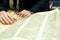 The rabbi`s hands are holding a Torah scroll. Torah reading