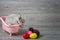 Rabbit in the bathtub placed on a wooden floor. Happy easter Fancy rabbit on a wooden background. Cute little rabbit on a pink bat