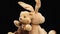 Rabbit with long ears and various teddy bears rotates on a black background