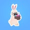 Rabbit in mask holding basket with eggs happy easter spring holiday coronavirus pandemic quarantine