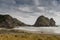 Rabbit rock at Piha Beach seen from the dunes.