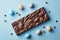 rabbit shaped chocolate bar with easter eggs isolated blue