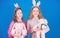 Rabbit style. Children in rabbit bunny ears. Spring holiday party. Egg hunt. Family and sisterhood. Little girls with