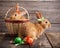 Rabbits with Easter eggs on wooden background