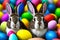 Rabbits among plenty of Easter eggs of different colors
