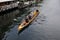 Race rowing boat sailing in christianshavn canal in Copenhagen