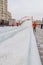 Race sledding at the Manege square in Moscow, Russia. happy children sliding down on snow tubes