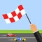 Race track. The hand with the flag shows the finish. Two cars ride at speed on the racetrack.