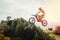 Racer child on motorcycle participates in motocross