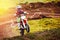 Racer child on motorcycle participates in motocross