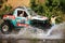 Racer off road at terrain racing car competition