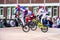 Racers jump from a springboard on the BMX track.