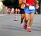 Racing and athletes in sportswear race on the streets