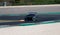Racing car Honda Civic challenging at turn on racetrack motor sport action