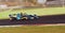 Racing car single seater modern formula in action close up blurred motion