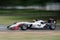 Racing Formula 1 vehicle speeding on circuit