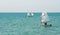 Racing sailboats near the lighthouse of the town of Pomorie
