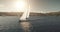 Racing yacht at sun reflection on sea bay aerial. Nobody nature seascape with sail boat at sunshine