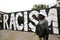 Racism graffiti in Brick Lane London with black man Black lives matter movement