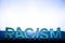 Racism - word from letters, the belief of inequality of human races racism concept.