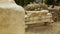 Rack focus shot of antique marble construction remains, archaeological finds