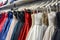 rack full of sleeveless and offshoulder evening gowns in a retail shop