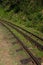 Rack railway on the top of a mountain on a sunny day. Cog railway tracks. Ooty, India, Nilgiri.