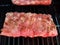 rack of ribs meat on barbecue grill cooking