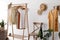 Rack with stylish women`s clothes. Interior design