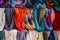 A rack with various and colorful summer scarves from a street vendor