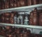 Racks in a pottery workshop with pottery, many different pottery standing on the shelves in a potery workshop