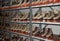 Racks of tan and orange roller skates for rental at a roller rink