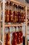 Racks of violins hanging in a violin repair shop