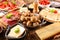 Raclette cheese party on wood background
