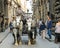 Racy coachman rides in a carriage pulled by horses in Florence