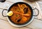 Racy seafood paella with mussels, calamari and prawns