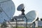 Radar antenna on satellite links center, telecommunication tower, wireless communication concept, clear blue sky