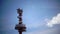 Radar tower beacon against the background of the blue sky in sunny day