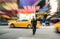 Radial blur of yellow taxicabs and unidentified person in New York City