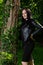 Radiant Beauty Amidst Nature\\\'s Embrace: Joyful Woman in Black Attire