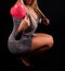 Radiant Beauty: Young Woman with Heart-shaped Balloon in Studio on Black Background