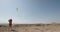 Radiant Child Running with a Beautiful Kite in the Expansive Countryside