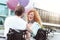 Radiant couple beaming while holding balloons and chatting