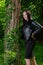 Radiant Happiness in Nature\\\'s Embrace: Attractive Woman in Black Attire