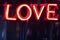 Radiant Love: Neon Sign on Dark Background for Valentine\\\'s Day