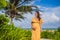 A radiant pregnant woman after 40 basking in the sun& x27;s warmth on a tropical beach, cherishing the serenity and bliss